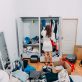 Nice-looking lady inside modern apartment room prepare to trip, around the mess